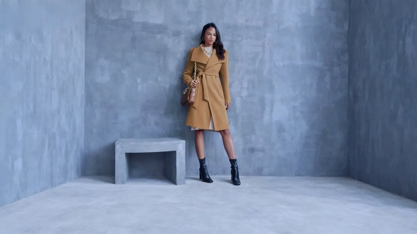 Woman wearing cicybell jacket leaning against the wall