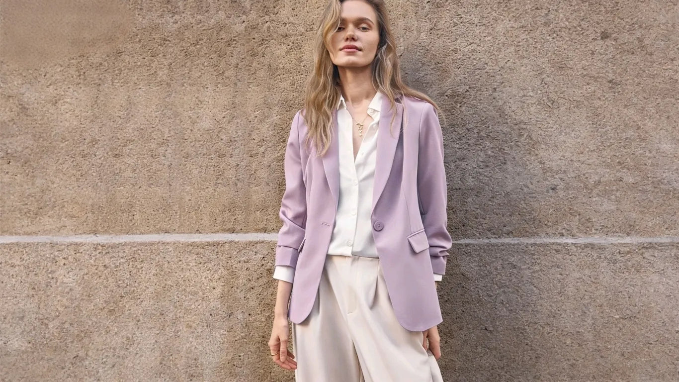 The woman was photographed on the street wearing a lavender casual work blazer.