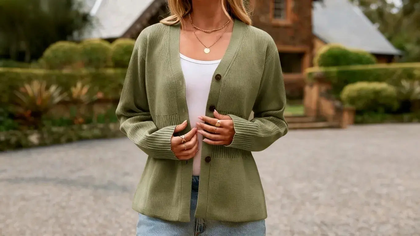 A woman is wearing a Cicybell green cardigan in the park.