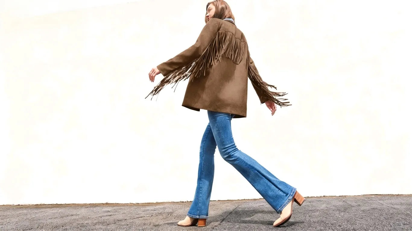 A woman wearing a cicybell jacket goes out shopping