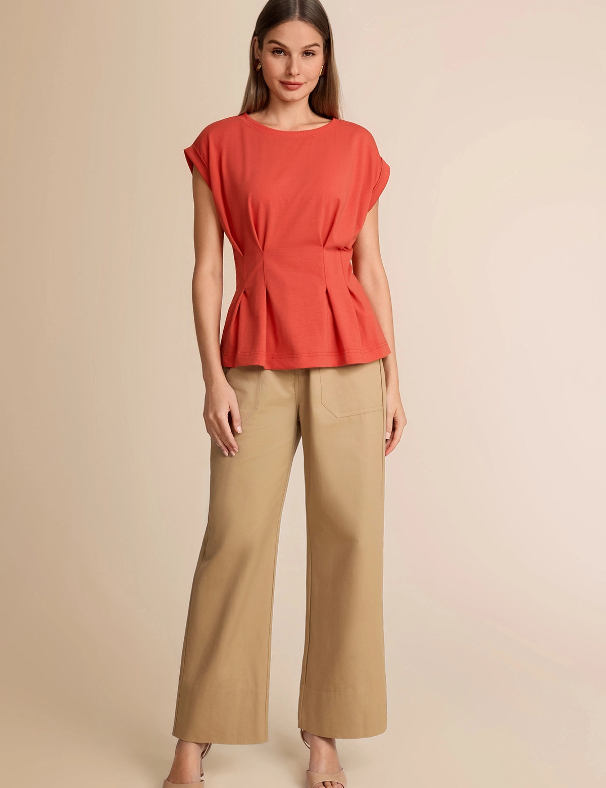 Summer 2026 office outfit featuring a brick red peplum top paired with wide-leg khaki trousers