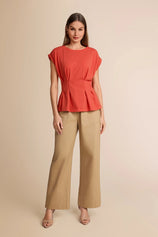 Summer 2026 office outfit featuring a brick red peplum top paired with wide-leg khaki trousers