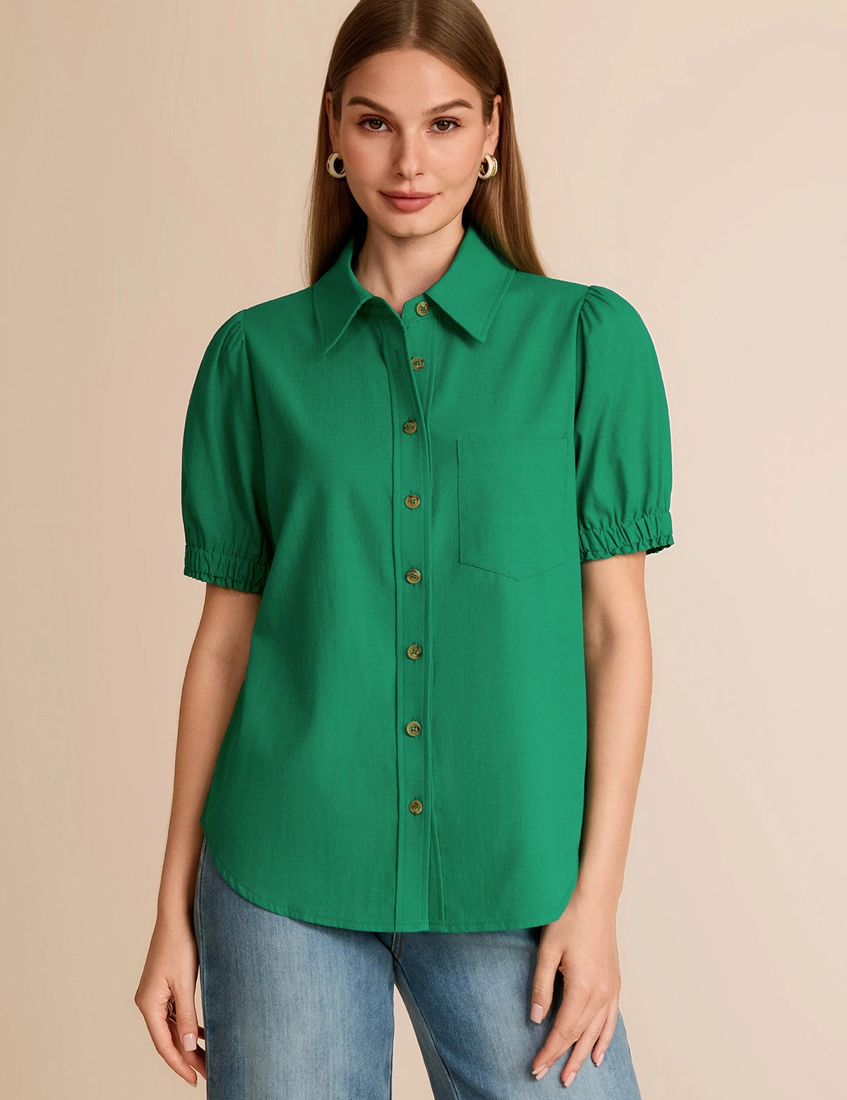 Professional woman wearing a vibrant emerald green puff short sleeve button-down shirt