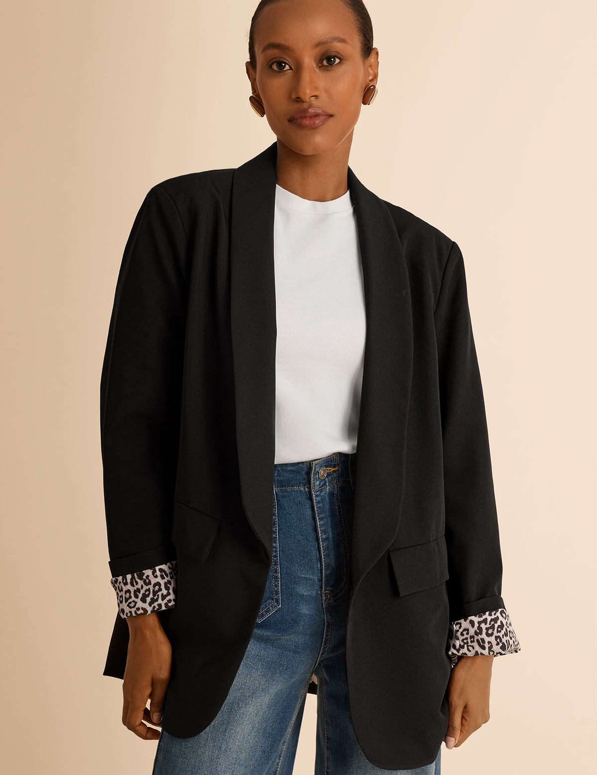 CicyBell Women's Black Business Casual Blazer with a chic shawl collar and leopard print lining. A professional model styles this open-front stretch work jacket with denim jeans and a white top for a modern office-to-evening look.