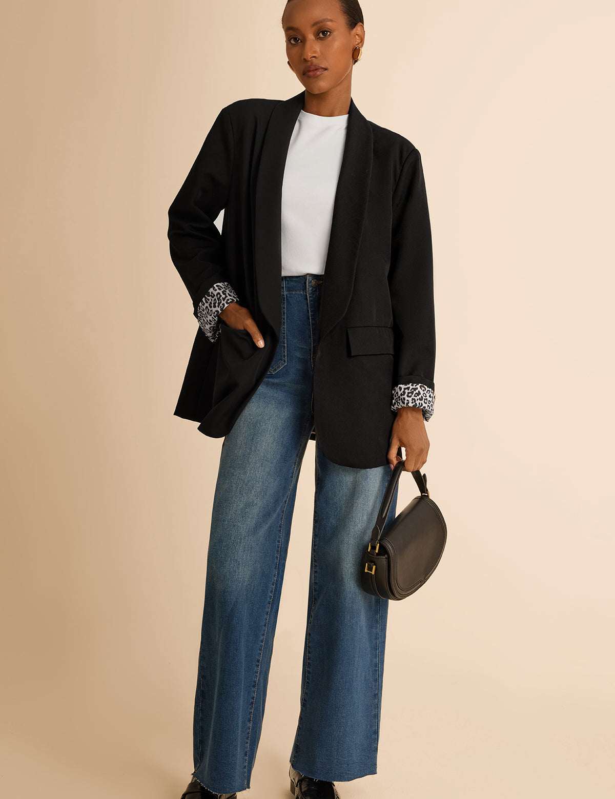 CicyBell Women's Black Business Casual Blazer with a chic shawl collar and leopard print lining. A professional model styles this open-front stretch work jacket with denim jeans and a white top for a modern office-to-evening look.