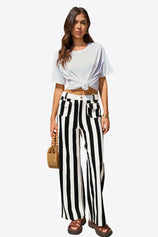 CicyBell Women's Black and White Vertical Striped Wide Leg Jeans. High waisted baggy denim pants featuring a leg-lengthening striped pattern and trendy retro-chic silhouette for summer vacations.