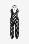 A bold and vibrant Cicy Bell halter neck jumpsuit in a breezy, lightweight fabric. Highlights the flattering plunging V-neckline and relaxed jogger silhouette, designed as a "one-and-done" vacation essential for beachside brunches or sunset parties.