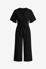 CicyBell Women's Black Wide-Leg Romper featuring an elegant tie-knot front and flowy flutter sleeves. This chiffon-feel one-piece outfit offers a flattering V-neckline and elastic waist, perfect for beach weddings or office wear.