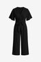 CicyBell Women's Black Wide-Leg Romper featuring an elegant tie-knot front and flowy flutter sleeves. This chiffon-feel one-piece outfit offers a flattering V-neckline and elastic waist, perfect for beach weddings or office wear.