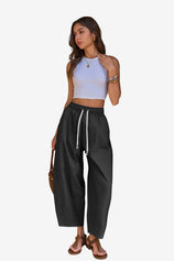 Cicy Bell Women's Barrel Pants featuring a trendy baggy fit and unique vertical seam details. These breathable cotton trousers include an adjustable drawstring waist and a relaxed "horseshoe" silhouette for an effortless street style look.