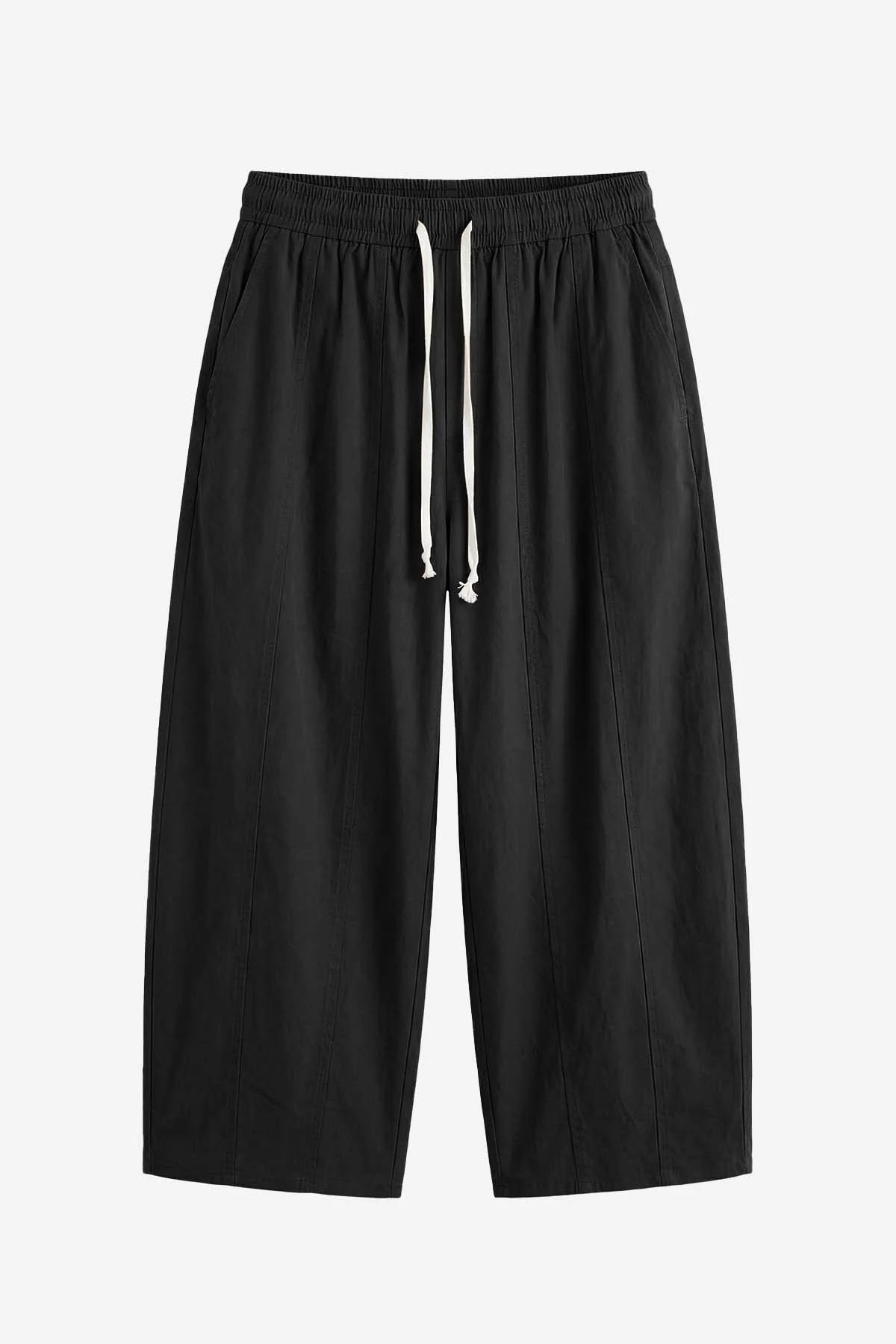 Cicy Bell Women's Barrel Pants featuring a trendy baggy fit and unique vertical seam details. These breathable cotton trousers include an adjustable drawstring waist and a relaxed "horseshoe" silhouette for an effortless street style look.