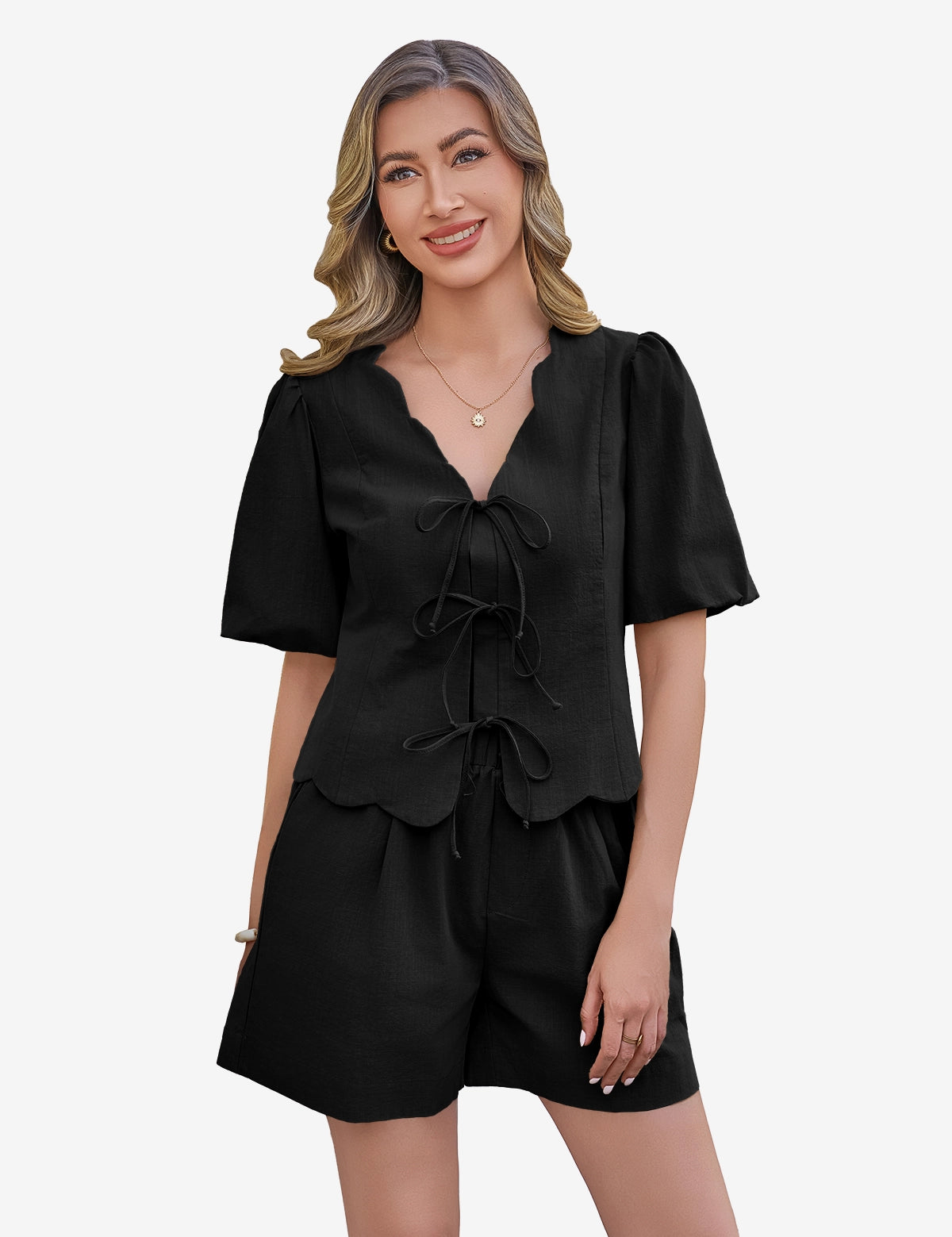 CicyBell Women's Black 2 Piece Set in 100% cotton. A model showcases the tie-front puff sleeve top with a romantic ruffle V-neck and matching high-waisted wide-leg shorts, perfect for a coordinated summer loungewear or beach look.