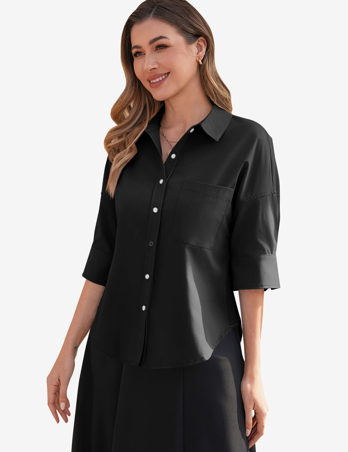 CicyBell Womens Black Oversized Button Down Shirt styled as a chic business casual outfit. A brunette model showcases the relaxed boyfriend fit, half-sleeves, and classic collar, perfect for office days or casual outings.