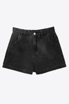 CicyBell Women's Baggy High-Waisted Jorts featuring a breezy wide-leg cut and unique oversized scalloped front pockets. These light blue denim shorts offer an effortless "cool girl" vibe with a comfortable elastic waistband for summer.