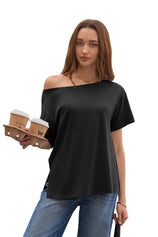 CicyBell Women's Black Oversized Asymmetric Tee with a 2-in-1 boat neck. Model styles it off-one-shoulder for a chic, breezy vibe. This black tunic features drop shoulders and side slits, perfect for coffee dates or casual strolls.