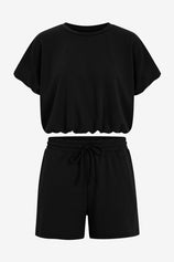 CicyBell Women's Black 2-Piece Set featuring a short puff sleeve top and matching drawstring shorts with pockets. A chic and cozy loungewear outfit perfect for summer coffee runs and casual daily wear.