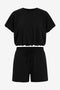 CicyBell Women's Black 2-Piece Set featuring a short puff sleeve top and matching drawstring shorts with pockets. A chic and cozy loungewear outfit perfect for summer coffee runs and casual daily wear.