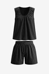 Alt Text: CicyBell Women's Black 2-Piece Matching Set in 100% cotton. Features a sleeveless ruffled babydoll top with a U-neckline and matching relaxed-fit shorts, ideal for beach vacations and summer resort trips.
