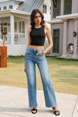 CicyBell Women's Blue High Waisted Wide Leg Jeans in a classic wash. Full-length shot of a model wearing these baggy, loose-fit stretchy denim pants with a black tank top, perfect for effortless casual streetwear or weekend outfits.