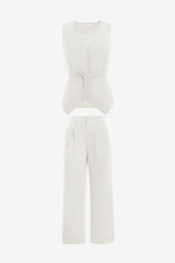Cicy Bell Women's 2-Piece Vest Set featuring a tailored sleeveless blazer with an adjustable tie-waist and breezy wide-leg trousers. This modern power suit offers a flattering cinched silhouette and functional side pockets for a professional look.