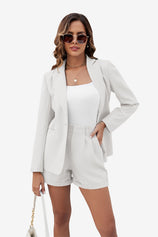 Cicy Bell Women's 2-Piece Blazer and Shorts Set featuring a tailored notch lapel blazer and high-waisted cuffed mini shorts. This polished summer power suit includes a single-button closure and functional pockets in a stretch-infused, wrinkle-resistant blend.