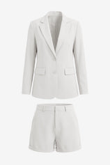 Cicy Bell Women's 2-Piece Blazer and Shorts Set featuring a tailored notch lapel blazer and high-waisted cuffed mini shorts. This polished summer power suit includes a single-button closure and functional pockets in a stretch-infused, wrinkle-resistant blend.