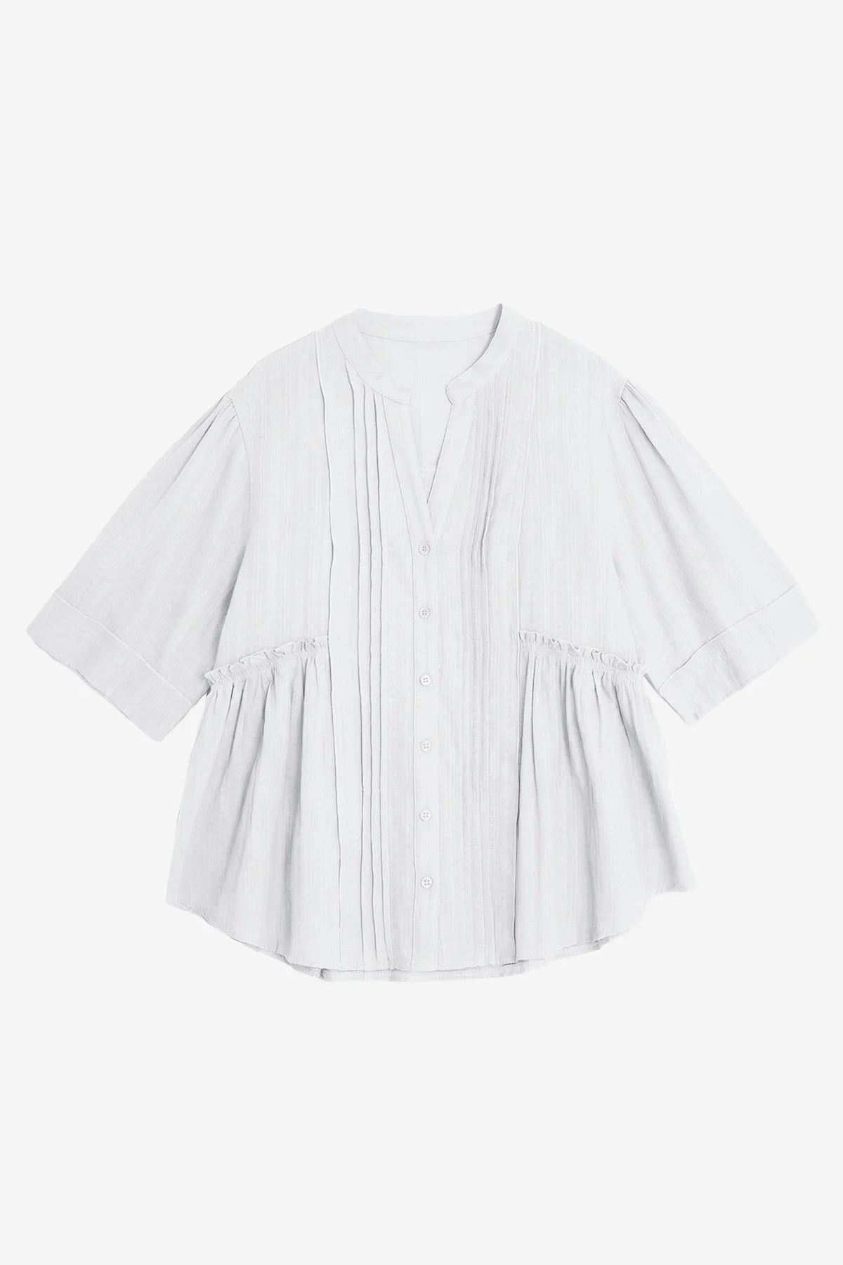 A textured CicyBell pleated peplum blouse for women. Highlights the unique layered aesthetic from the front and back pleating and functional button closure. Crafted from breathable, wrinkle-resistant cotton for an effortlessly put-together summer style.